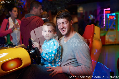 Image of father and son playing game in playground