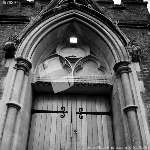 Image of wooden parliament in london old church door and marble antique  