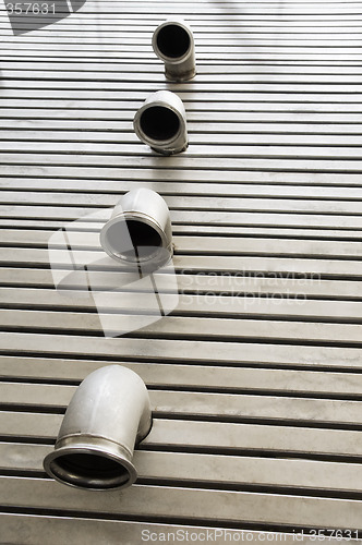 Image of Pipes in a metal floor