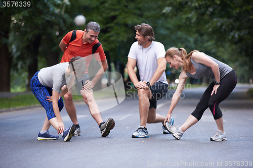 Image of jogging people group stretching