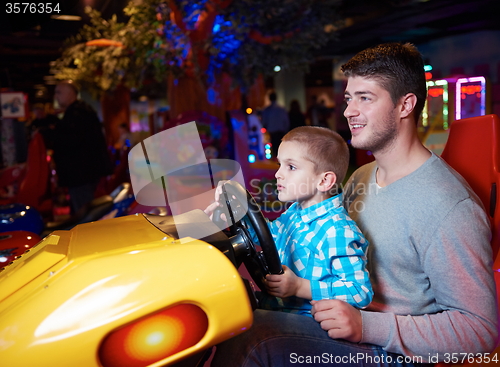 Image of father and son playing game in playground