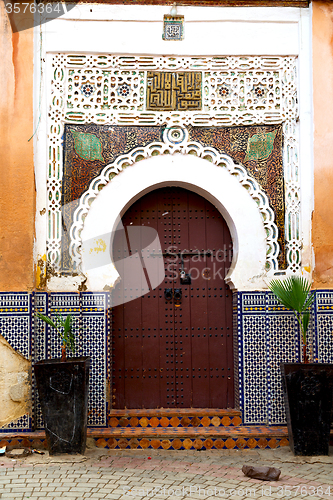 Image of old door in morocco  wall ornate brown