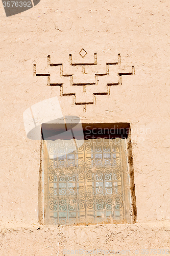 Image of   window in morocco old construction and brown wall  