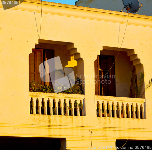 Image of   yellow window in morocco africa old construction and brown wal