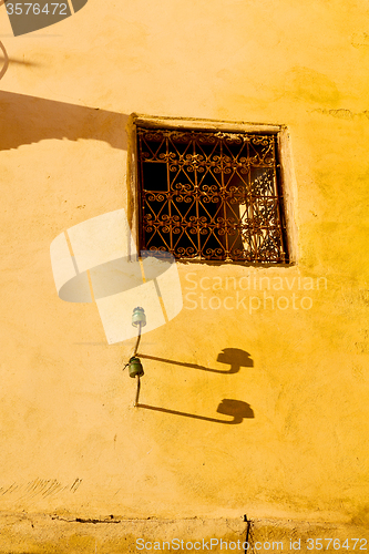 Image of   yellow window in morocco   construction  brown wall  