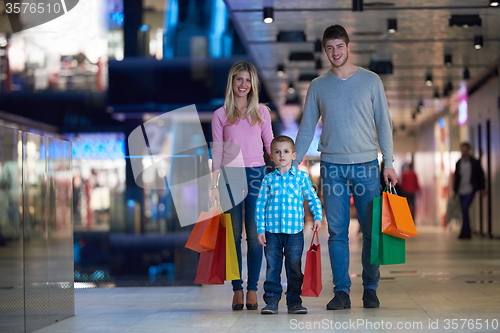 Image of young family with shopping bags