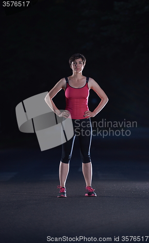 Image of woman  stretching before morning jogging