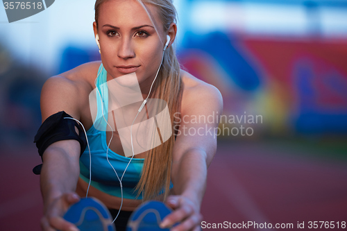 Image of sporty woman on athletic race track