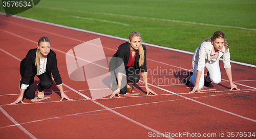 Image of business woman ready to sprint