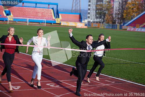 Image of business people running on racing track