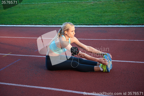 Image of sporty woman on athletic race track