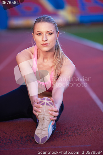 Image of sporty woman on athletic race track