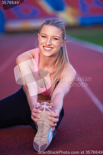 Image of sporty woman on athletic race track