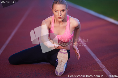 Image of sporty woman on athletic race track