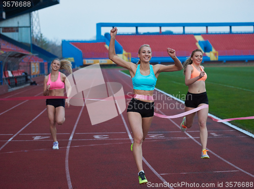 Image of Female Runners Finishing Race Together