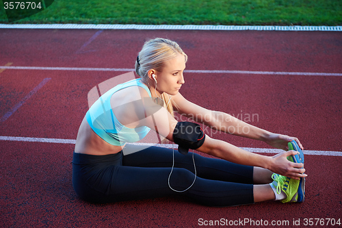 Image of sporty woman on athletic race track