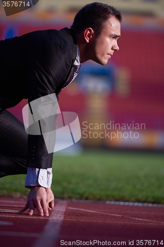 Image of business man ready to sprint