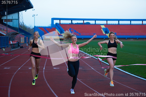 Image of Female Runners Finishing Race Together