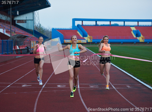 Image of Female Runners Finishing Race Together