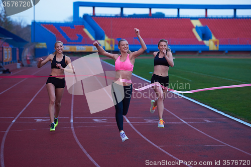 Image of Female Runners Finishing Race Together