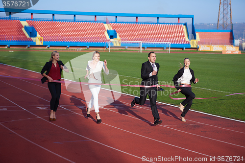 Image of business people running on racing track