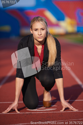 Image of business woman ready to sprint