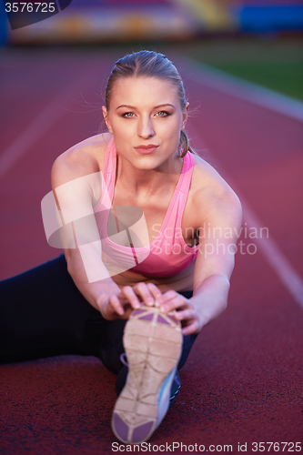 Image of sporty woman on athletic race track