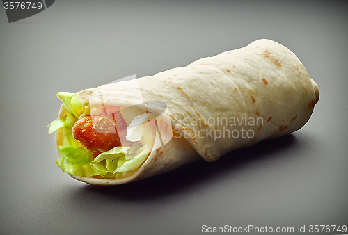 Image of Wrap with fried chicken and vegetables