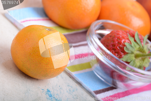 Image of Fresh colorful fruits composition mandarin, strawberry, peach, bananas and orange