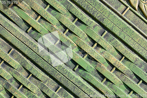 Image of Green metal texture with patches of rust steel on its surface, taken outdoor