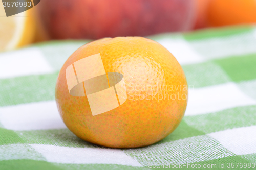 Image of many different fruits for the health of the entire family, peach, mandarin, strawberry slices