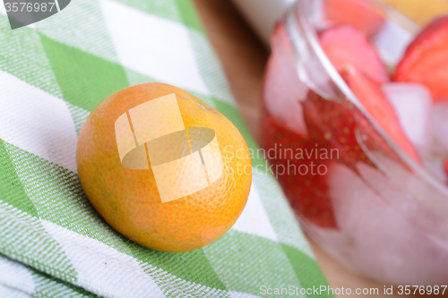 Image of mandarin and strawberry slices as health food concept