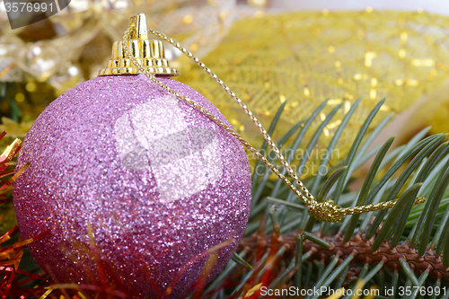 Image of Closeup of Christmas balls and green fir tree branch, new year invitation card