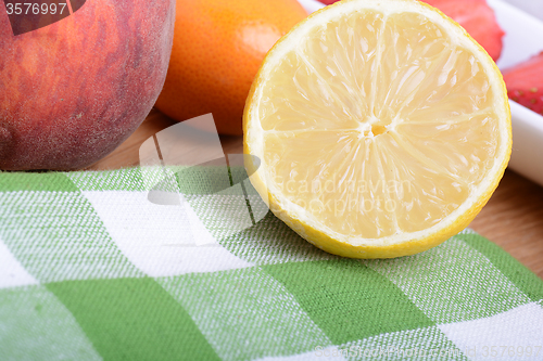 Image of Close up of a cup of sliced strawberries with lemon