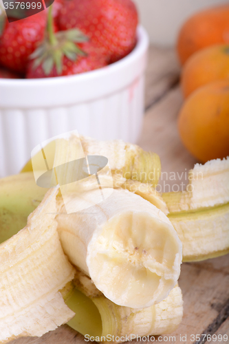 Image of Fresh colorful fruits composition mandarin, bananas and orange