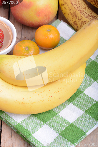 Image of mandarin, bananas and apples, health fresh food close up