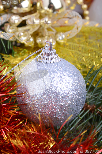 Image of Closeup of Christmas balls and green fir tree branch, new year invitation card