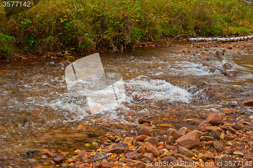 Image of Autumn river in taiga