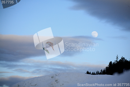 Image of Snowboardjump with moon behind