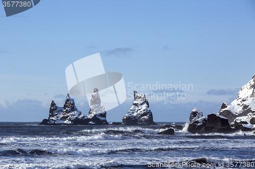 Image of Three pinnacles of Vik with rough waves, South Iceland   