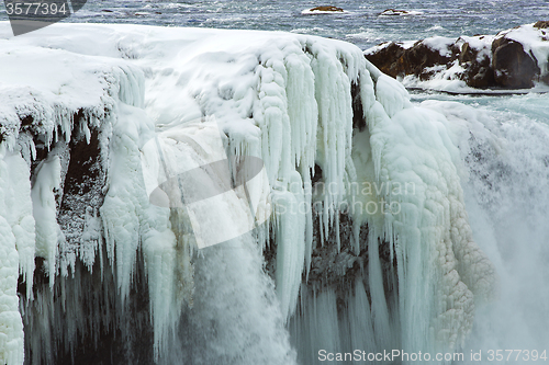 Image of Closeup of frozen waterfall Godafoss, Iceland
