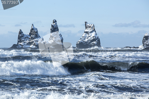 Image of Three pinnacles of Vik with rough waves, South Iceland   