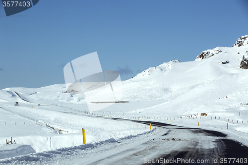 Image of Snowy and slippery road with volcanic mountains in wintertime