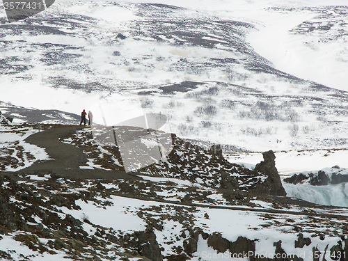 Image of Tourists at the Icelandic waterfall Godafoss in wintertime