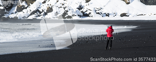 Image of Photographer at the black sand beach in Vik, Iceland