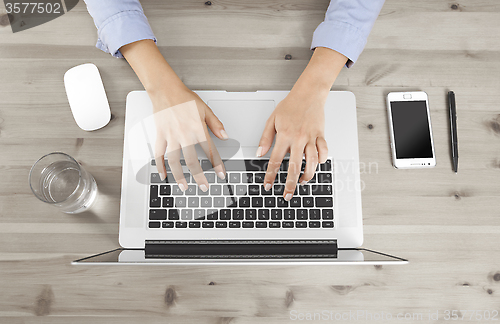 Image of hands working with laptop