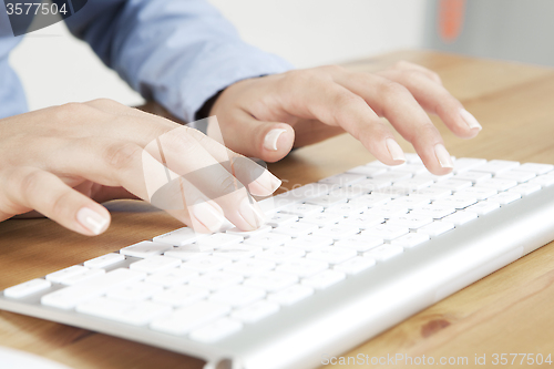 Image of beautiful finger tapping Keyboard