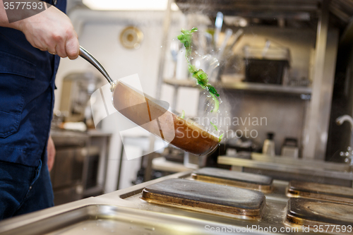 Image of Chef in restaurant kitchen