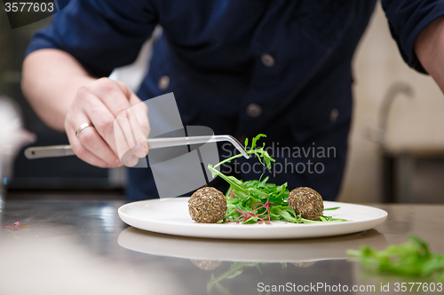 Image of Chef in hotel or restaurant, only hands