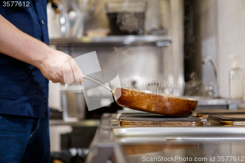 Image of Chef in restaurant kitchen